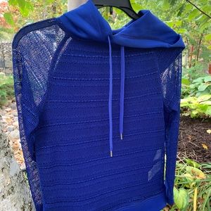 Kiind of like new knit hooded top with sequins.